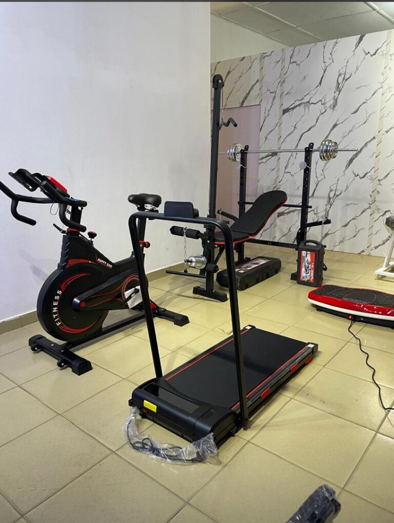 Woman controlling treadmill speed with a handheld remote while running, phone app shown alongside